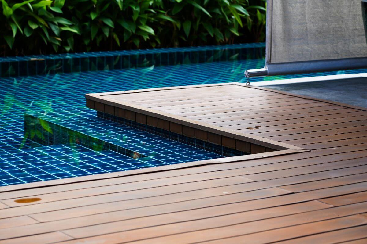 Homeowner comparing wood decking options to manage pricing and budget decisions in the Philippines