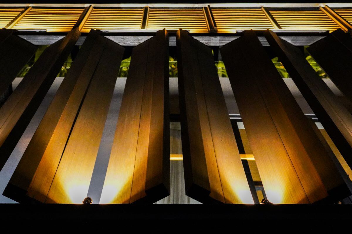 WPC louver with integrated lighting, showcasing its modern design and enhanced aesthetic appeal during nighttime.