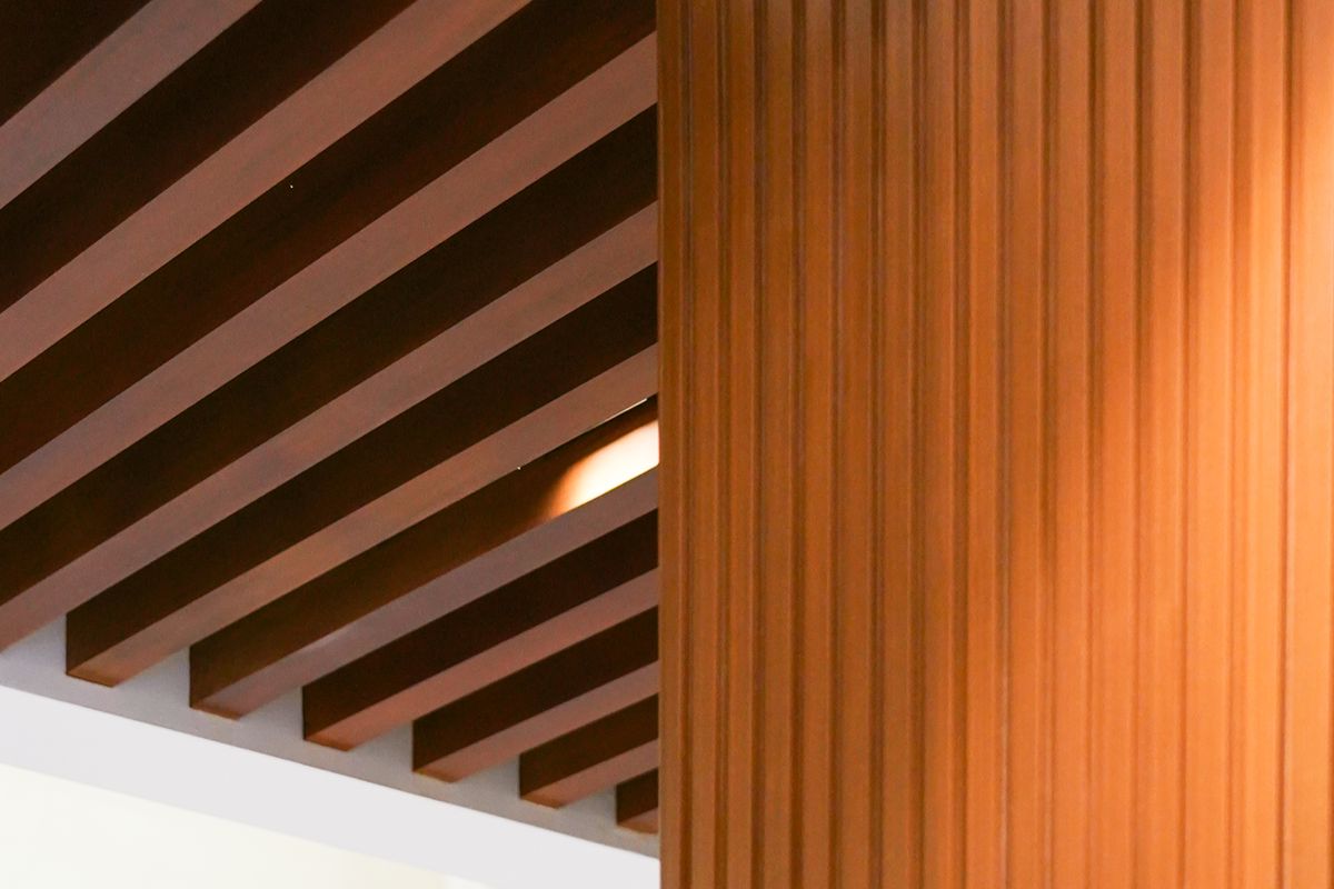 WPC ceiling beams and vertical wall cladding showing wood-inspired finishes for modern homes